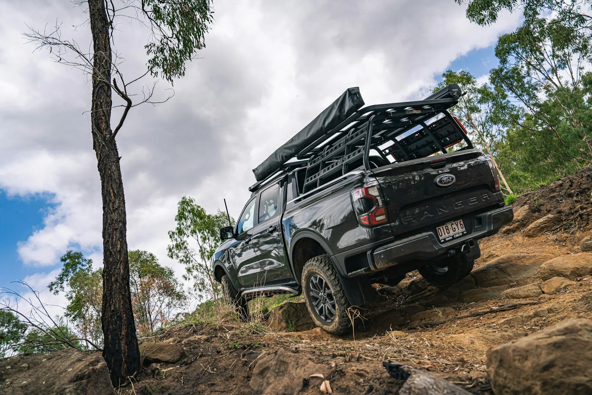 Four-wheel drive ute on a bush track in Swan Gully Park, Brisbane