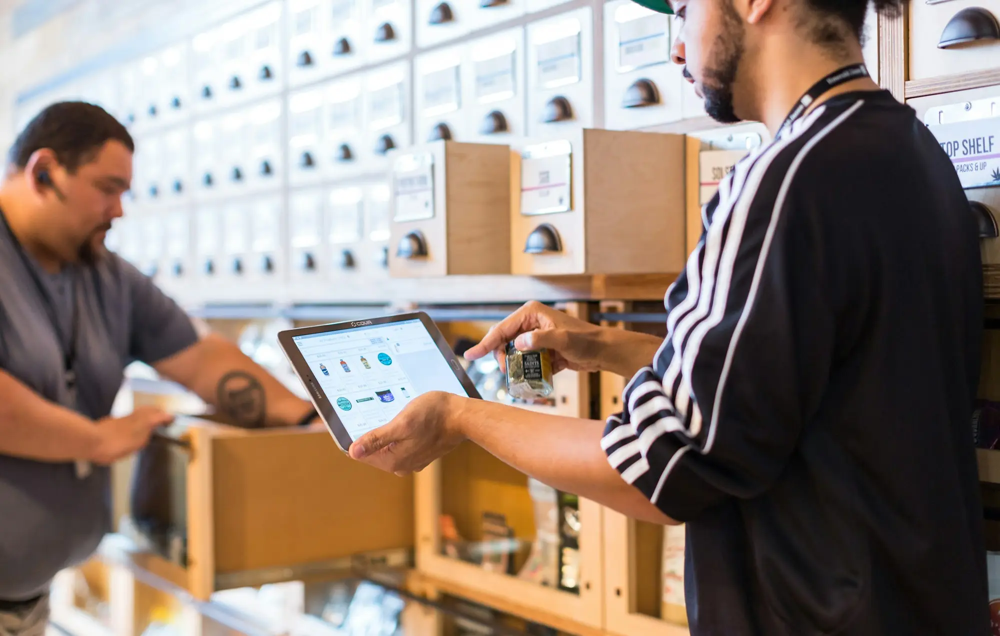 Established business owner checking stock on a tablet in the warehouse