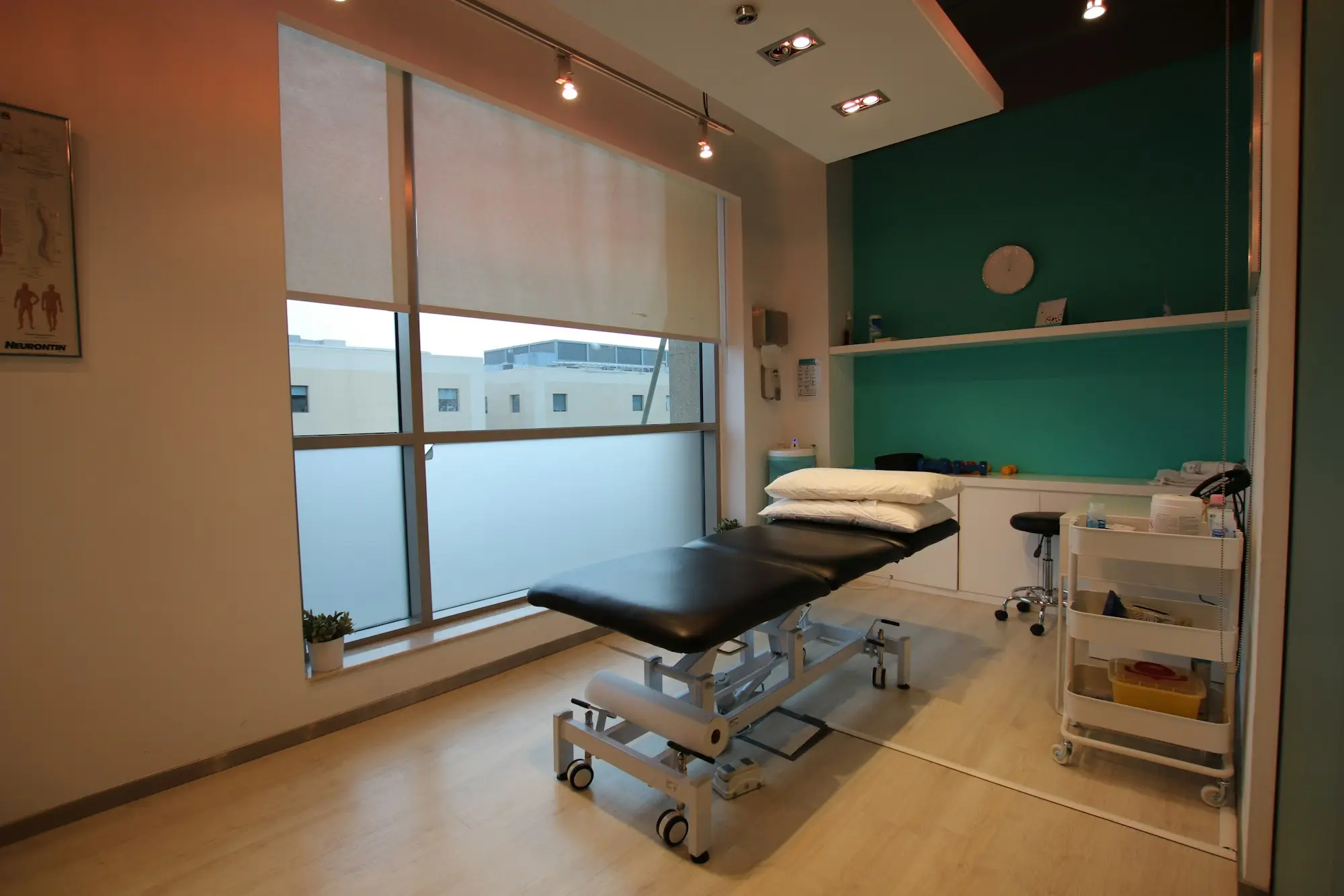 Physiotherapy clinic treatment room with a treatment table