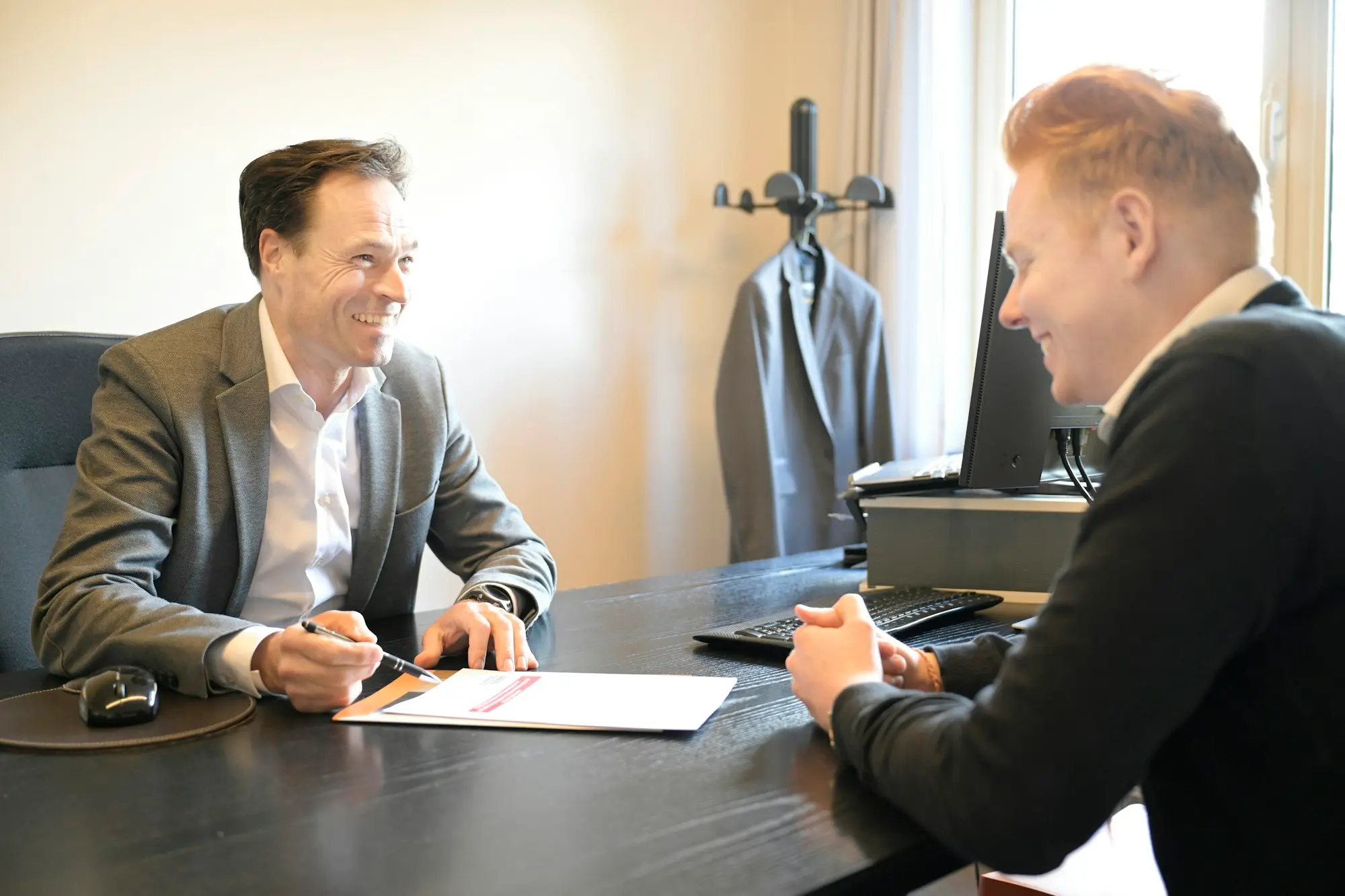 Professional services adviser meeting a client in the office